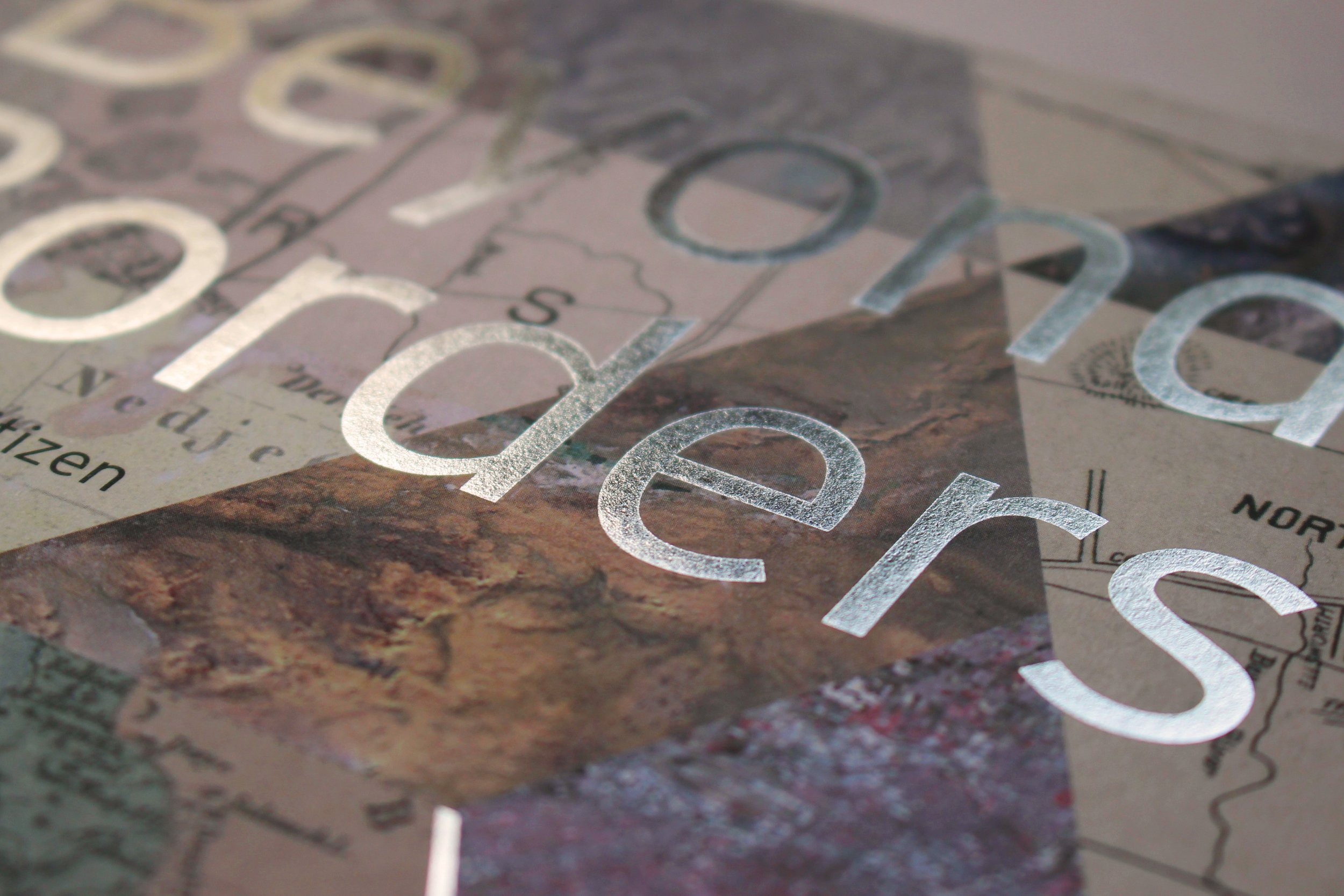 Beyond Borders cover detail: silver-foil typography over a cartographic and aerial-landscape collage