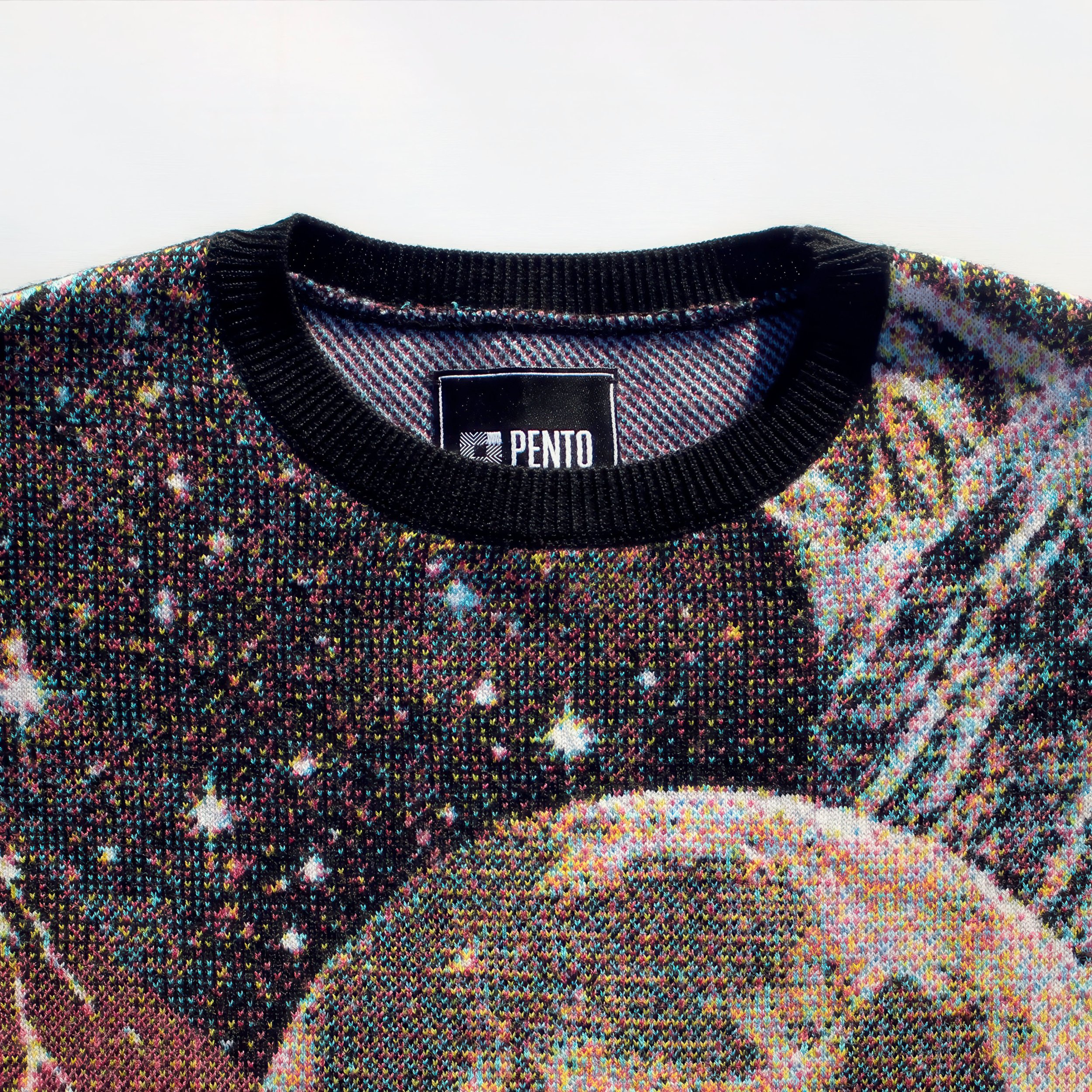 Close-up of a Pento jumper showing dithered, pixelated knit pattern