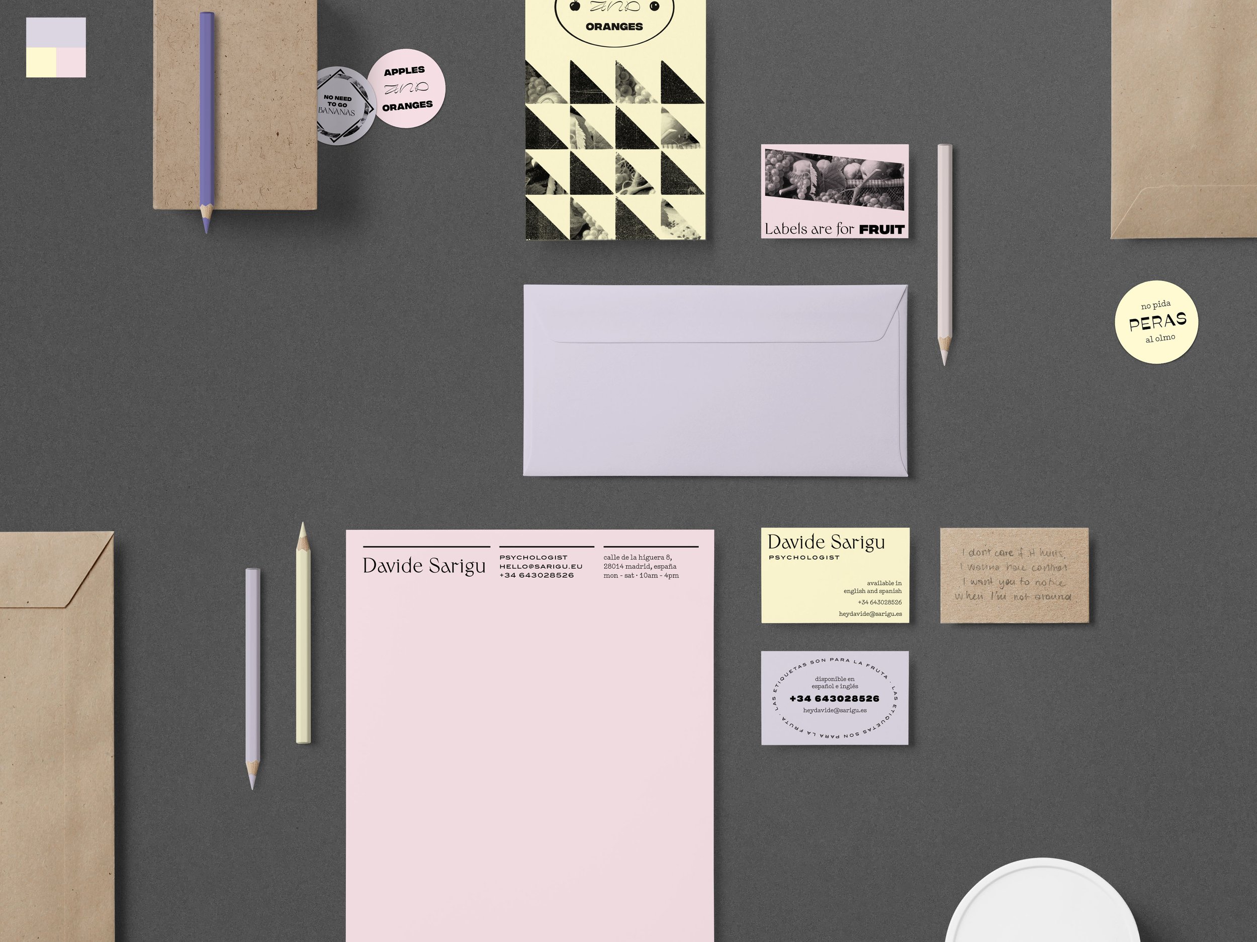 Davide Sarigu brand collateral flatlay on pastel paper stock
