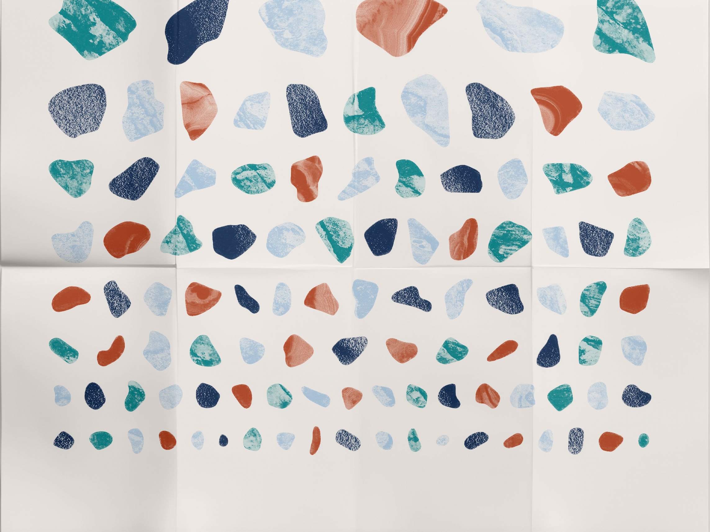 Pebble shapes and waterdrop motifs arranged in negative space